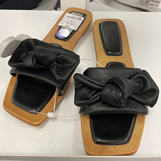 Low-cost dd’s store stylish black sandals with a front bow