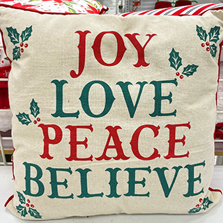 An image displaying a cute Christmas décor pillow “joy, love, peace, believe” from a dd's store