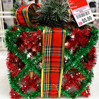 An image displaying a pretty Christmas red and green ornaments box from a dd's store